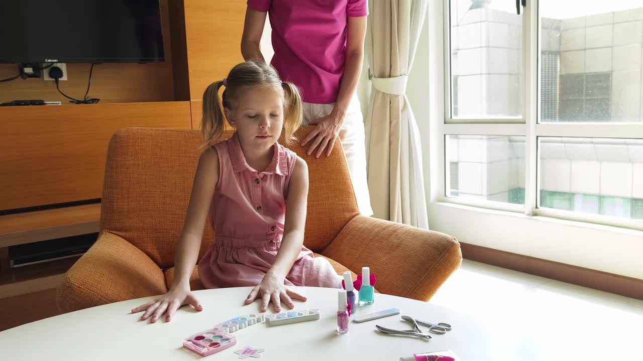 Mother and Daughter Playing with Nail Polish