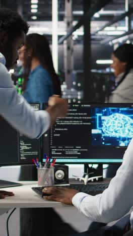 vertical video pleased data center manager praising work done by engineer