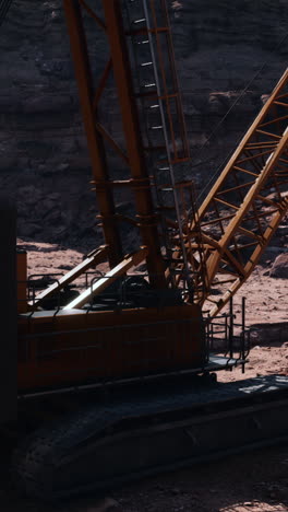 large orange crane in a quarry