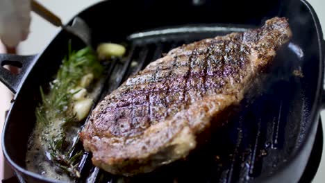 rib eye steak fried on hot pan 4k