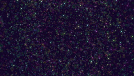 colorful dots scatter on dark background