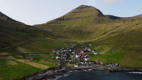 drone footage of the funningur village and the slættaratindur mountain on the eysturoy island in the faroe islands