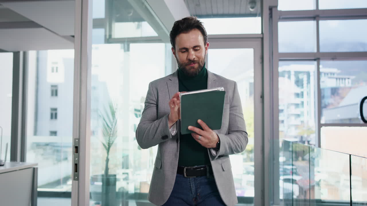 Man using a tablet in a modern office setting
