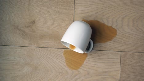 cup of coffee spilled wooden floor