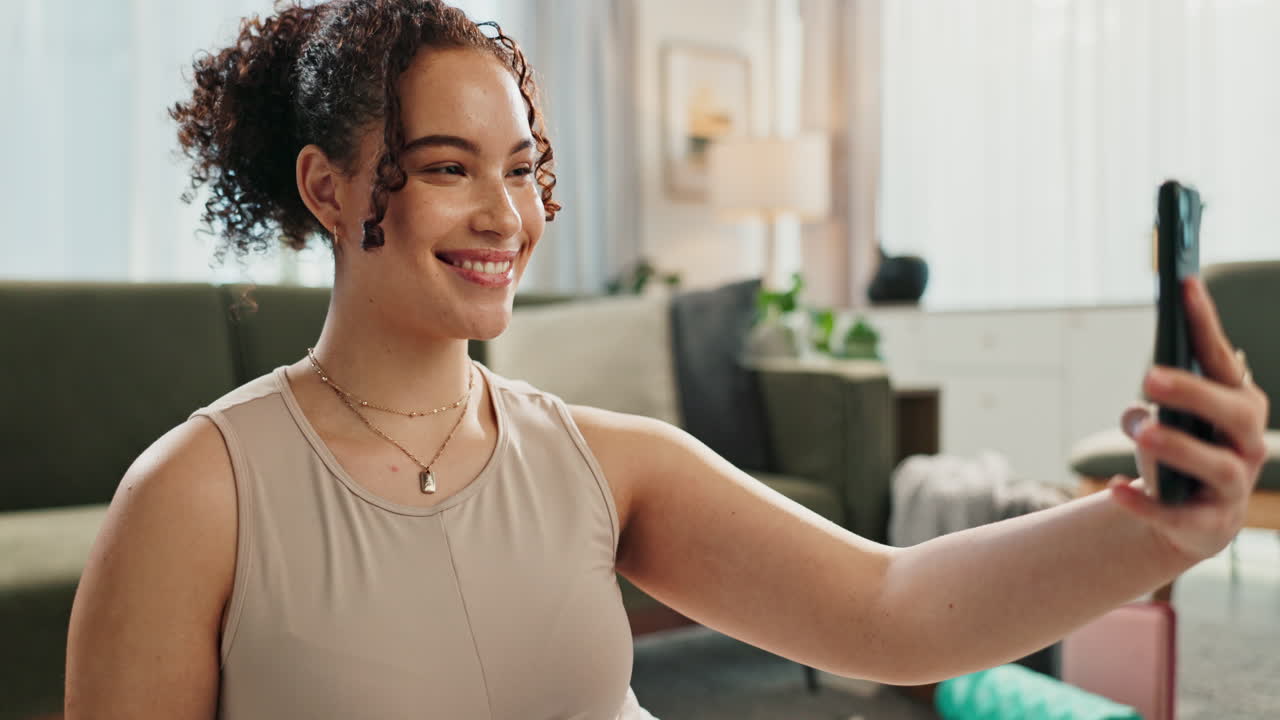 Woman taking a selfie at home