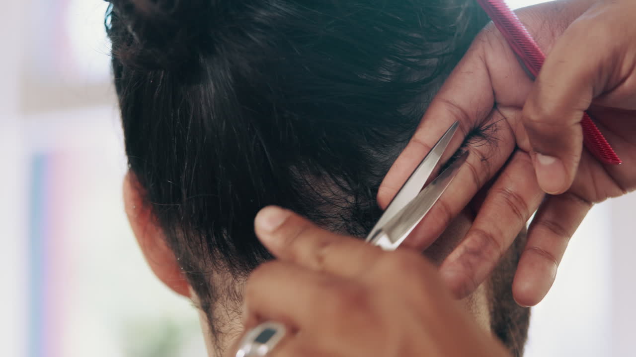 Close-up of Barber Cutting Man's Hair with Scissors