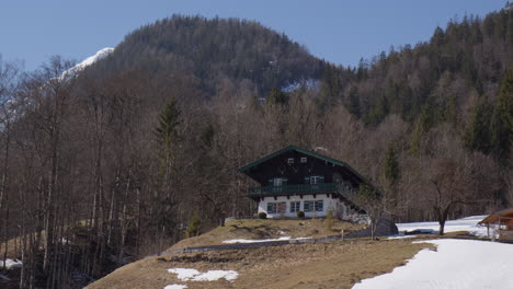 cabins at the mountains of hintersee in the bavarian alps near ramsau, germany. wide shot
