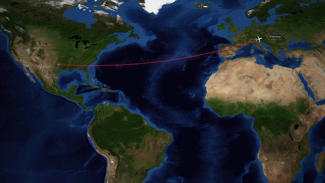 Digital world map tracks airplane flight path from Dallas to Vienna with red line