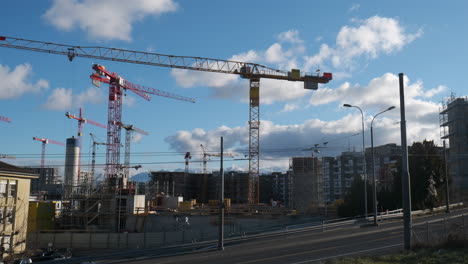 construction site in lausanne with numerous cranes moving, switzerland. time lapse