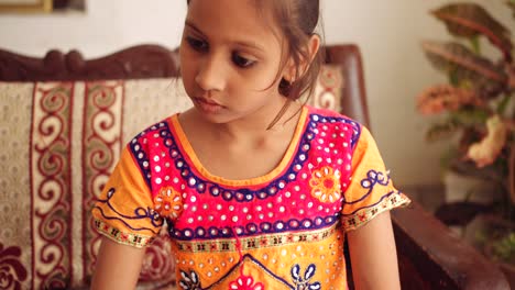 portrait of an indian child at home during coronavirus lockdown