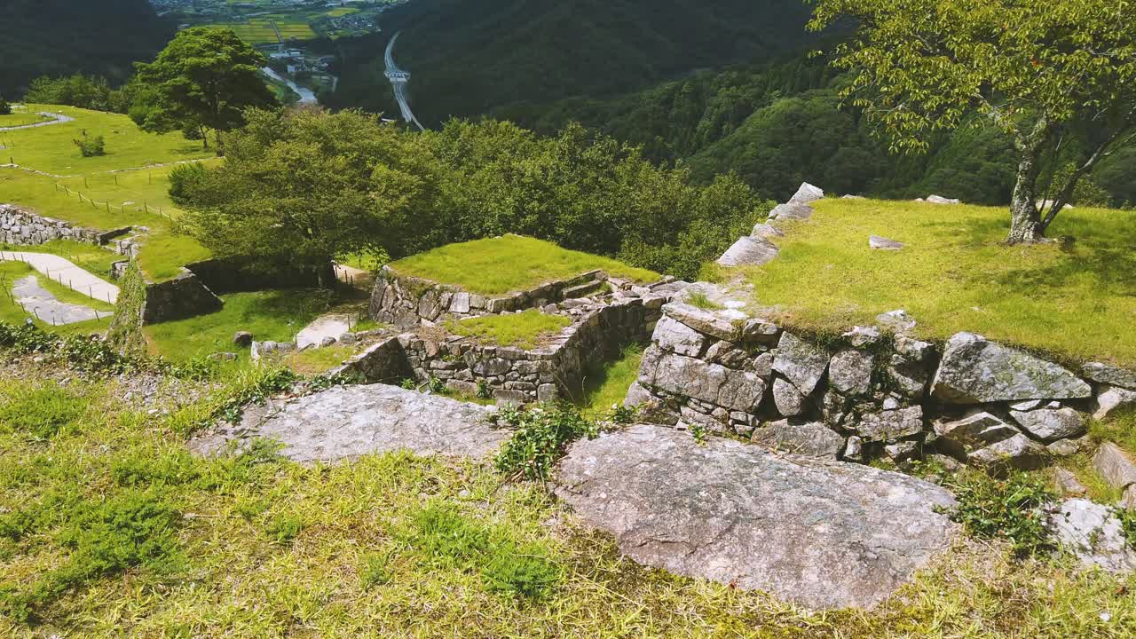Viewpoint of Japanese ancient Takeda castle landscape, natural greenery at mountains of Asago City in Hyogo