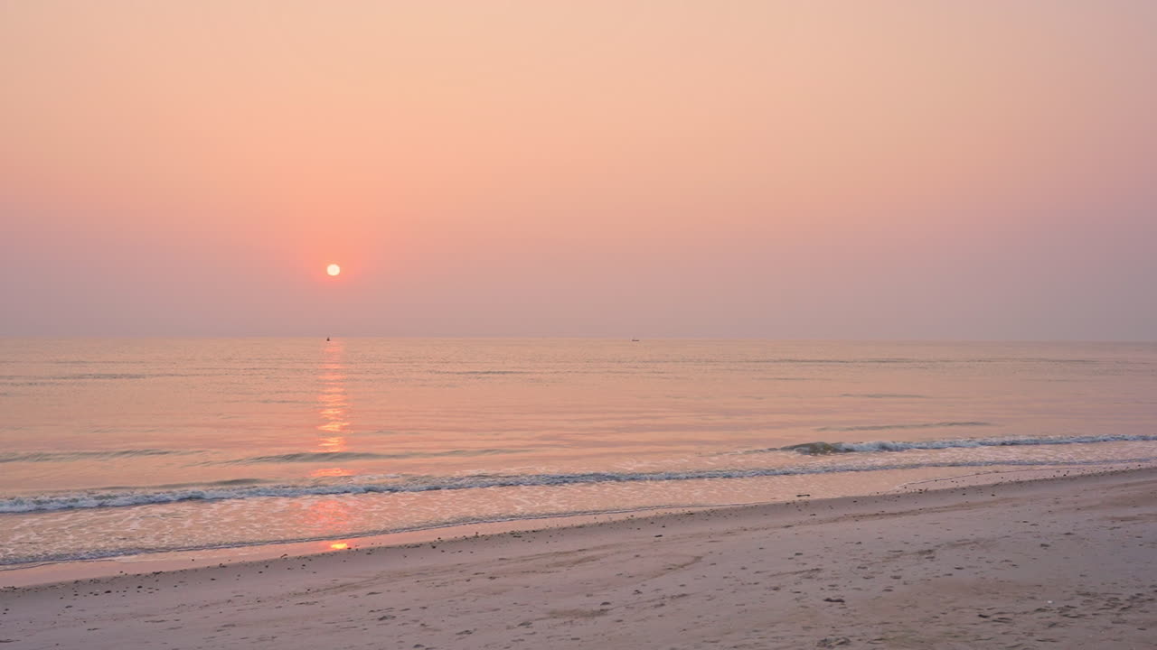 Amazing golden hour sunset at shore with beautiful sky with altocumulus castellanus clouds and dramatic light