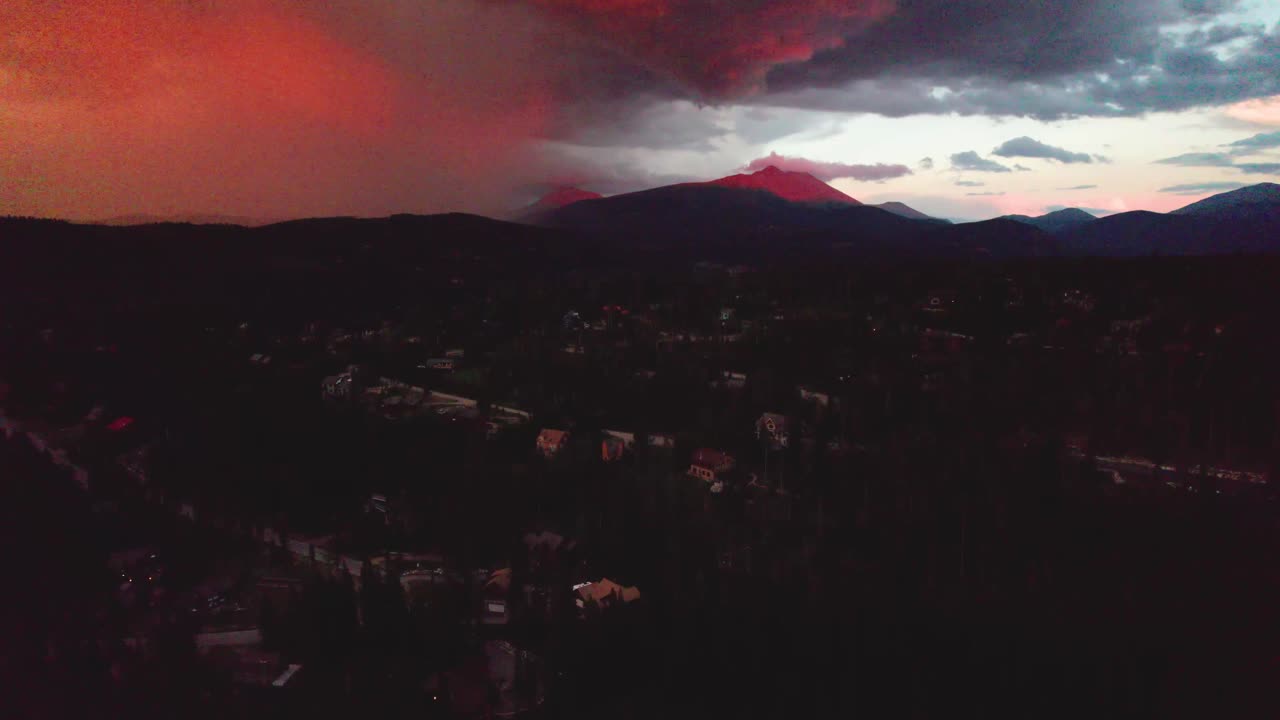 Aerial footage of a fire sunrise in Breckenridge Colorado. Camera is rising up slowly.