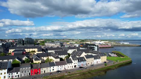 forward rising drone over lady facing the long walk in galway bay