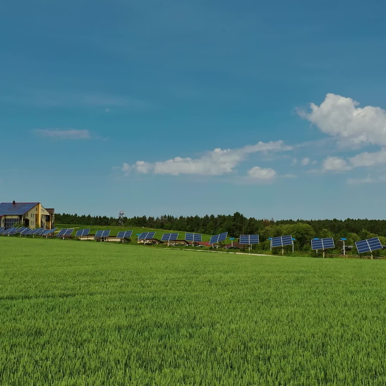 Innovative solar panels on field. Agricultural landscape in spring and photovoltaic solar cells to receive green energy from the sun. Ecological electricity.