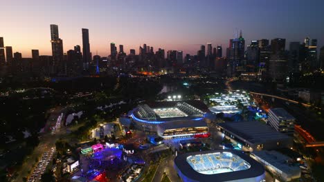 aerial drone view at nighttime of the rod laver and australian open in melbourne, victoria, australia