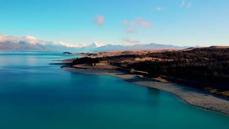 scenic view of lake pukaki in canterbury, new zealand with snowy southern alps in background