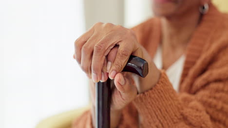 Hands,-walking-stick-and-senior-woman