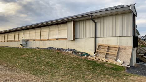 Panning-shot-of-industrial-pig-barn-in-rural-countryside