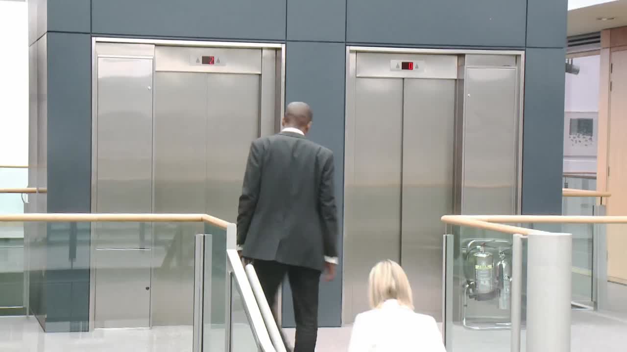 Business people shaking hands in a building