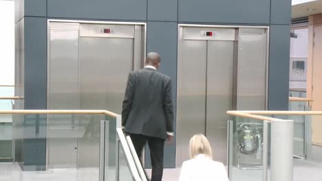 business people shaking hands in a building