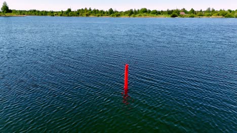 Delayed-Surface-Marker-Buoy-For-Scuba-Diving-In-Lake-In-Jurmala,-Latvia