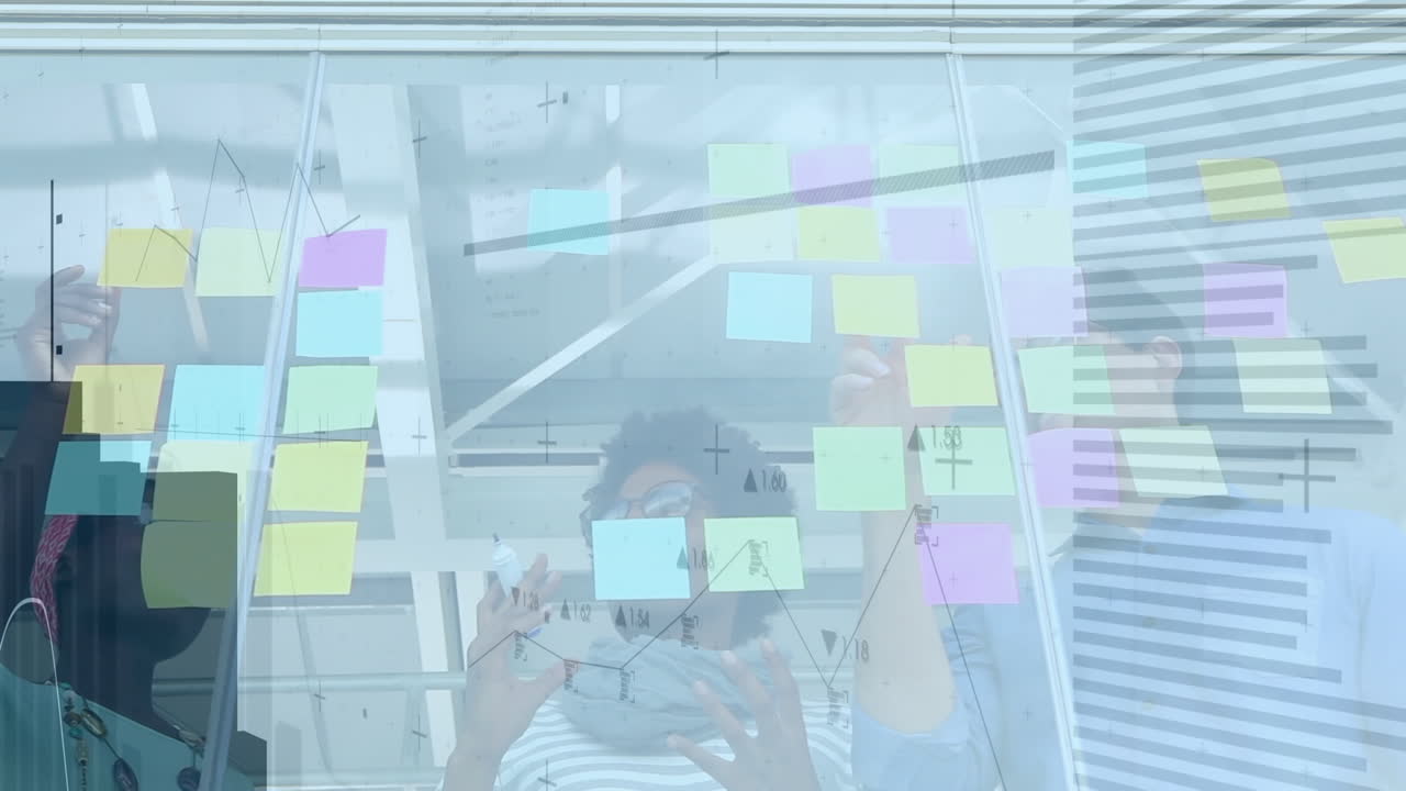 Animation of data processing over diverse group of business people taking notes on glass wall