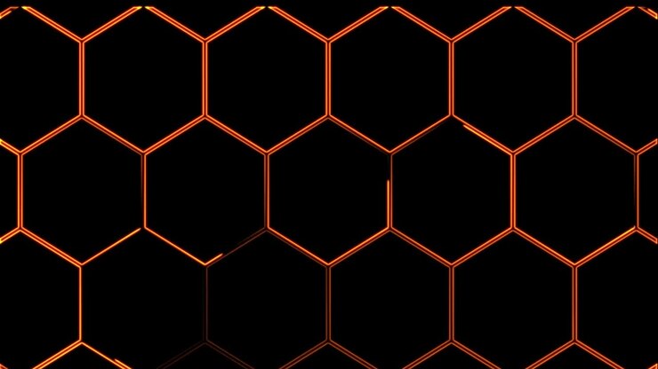 Abstract seamless 4K video animation. Video animation of glowing neon abstraction honeycomb orange yellow red on a black background.