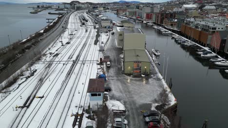 flying over railway tracks close to nidelven river in trondheim, norway