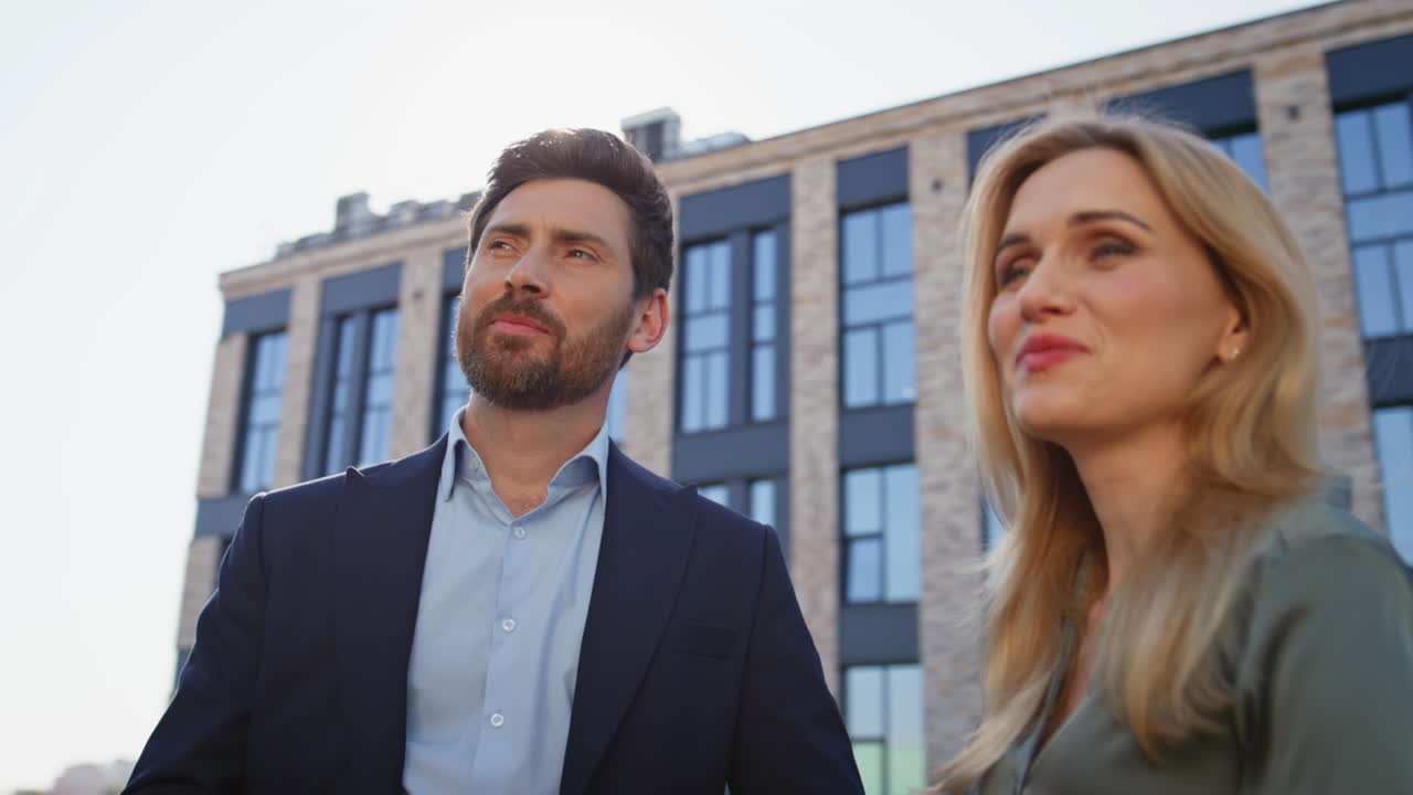 Smiling business couple standing street closeup. Corporate romance relationship