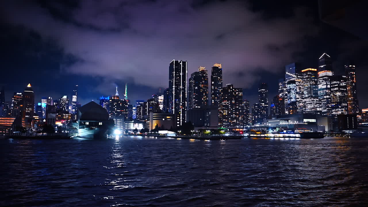 East River tour at dusk time. Footage near the Manhattan Bridge. The Brooklyn Bridge and New York skyline at backdrop