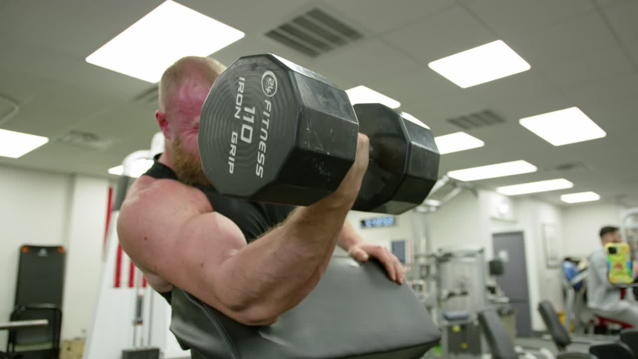 Strong bodybuilder strength workout in sport club