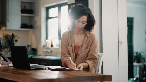smiling woman working at home on laptop