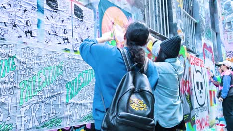 artists creating a mural in melbourne's iconic alley