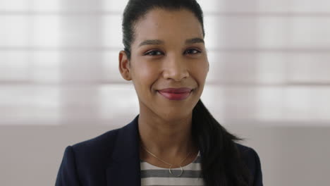 portrait of young independent mixed race business woman smiling confident looking at camera ambitious female executive close up