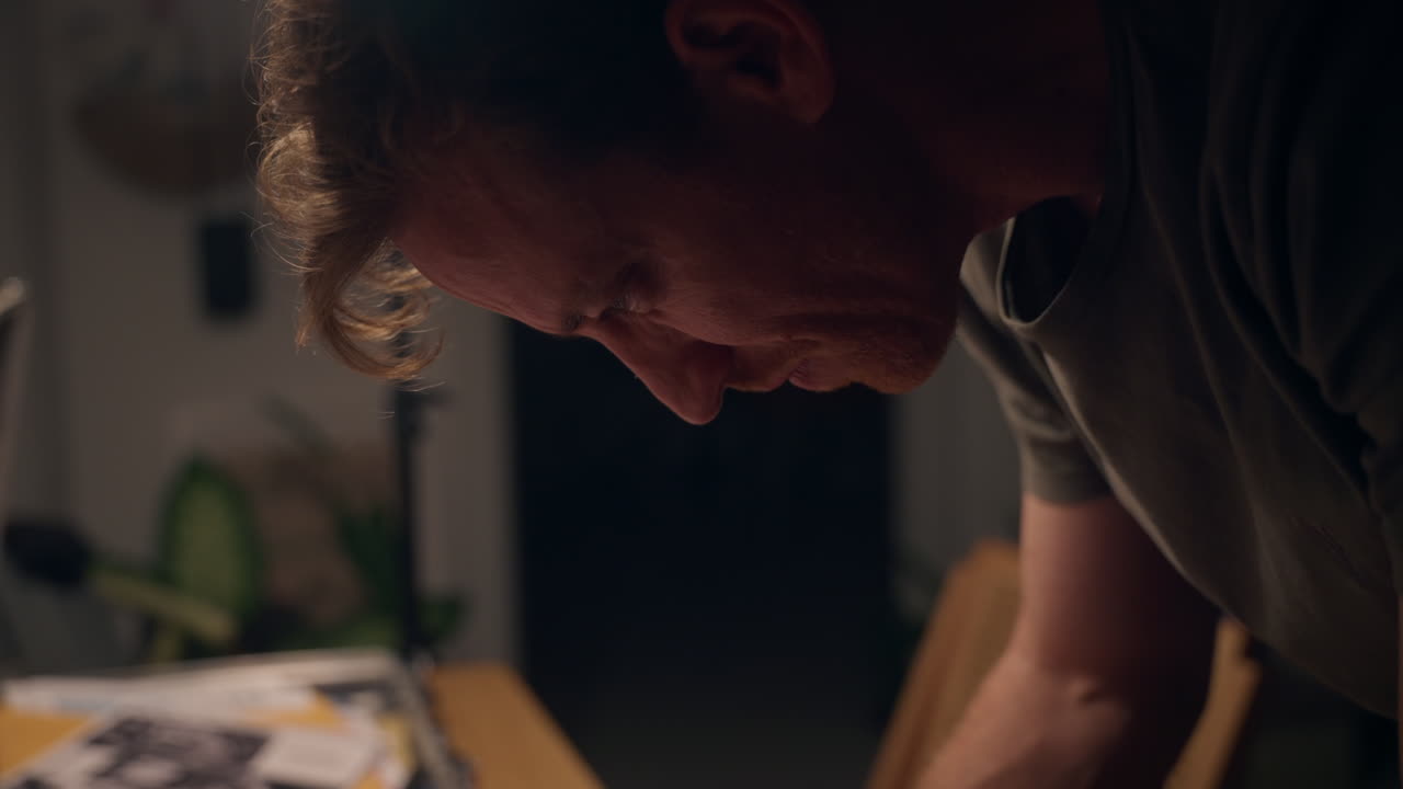 Close-up of hands flipping through classified documents on a wooden desk. Secret files, red stamps, and confidential papers evoke espionage, investigation, or government conspiracy themes