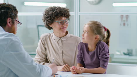 mother and little daughter having consultation with pediatrician
