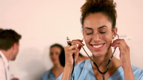 Portrait-of-a-nurse-holding-stethoscope