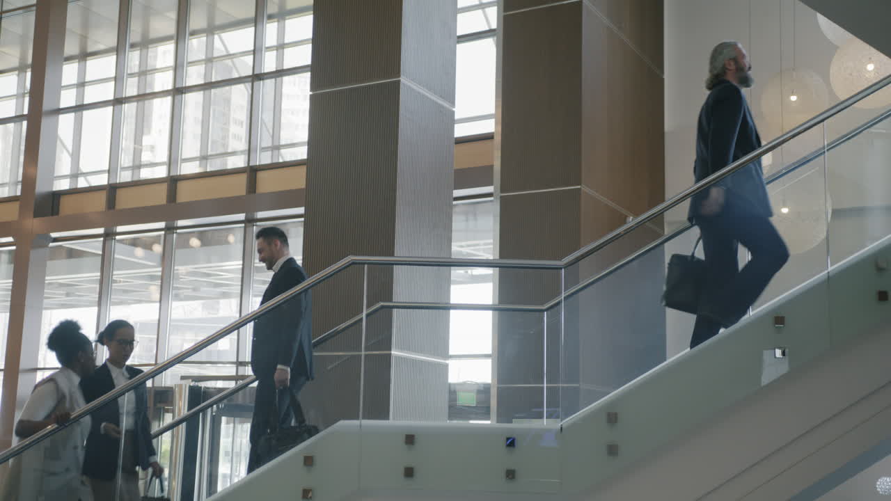 Business People Walking Up Stairs in Modern Office Building
