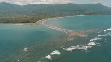 drone aerial wide view of whale tail beach marino ballena national park in uvita, costa rica