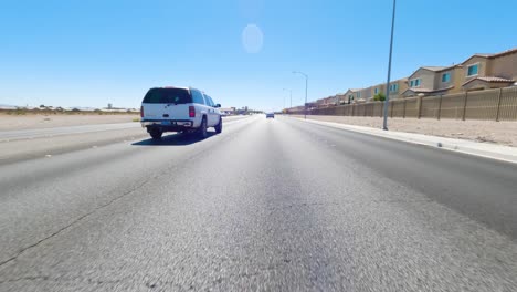 pov automobile driving down the road in nevada