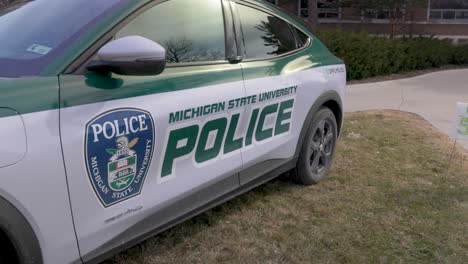 michigan state university police car on the campus of michigan state university, the site of a mass shooting in february of 2023