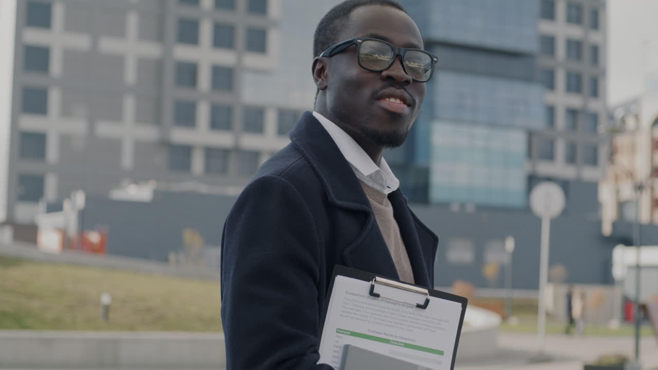 Businessman Outdoors with Documents