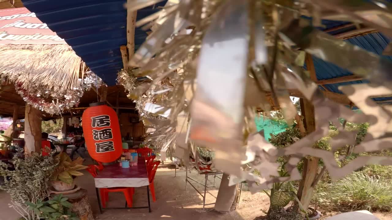 Small restaurant in remote village of Thailand decorated with chines writing