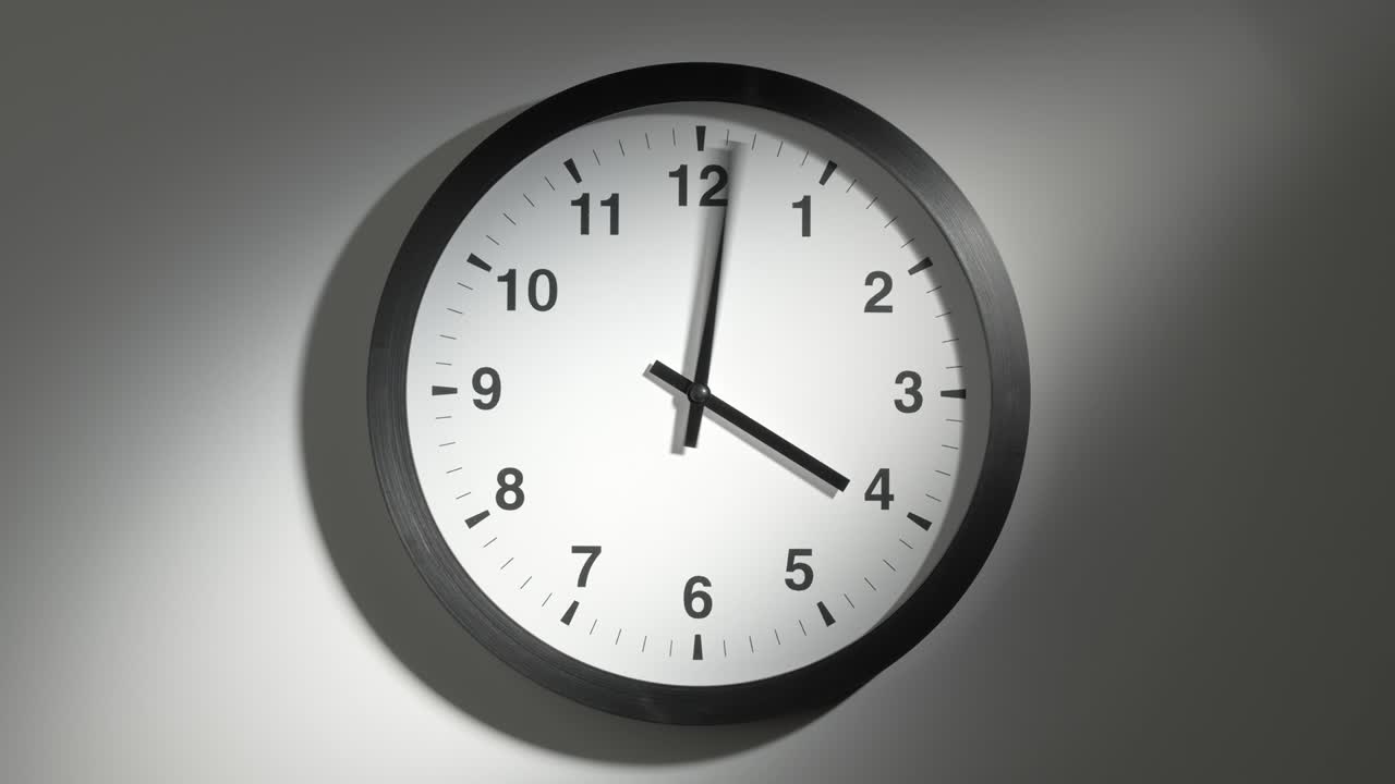 Clock Face in Time Lapse on White Wall in Office
