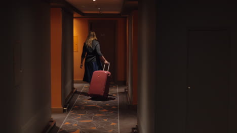 woman settling in hotel room