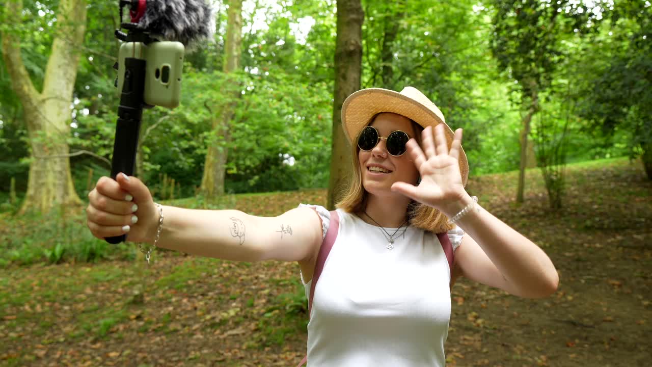 Woman Vlogging in Park