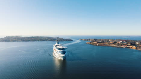 drone descending in front of a shuttle ferry at the suomenlinna island, helsinki