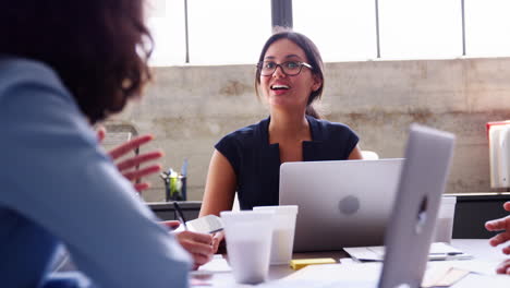 Young-businesswoman-at-an-office-meeting,-close-up