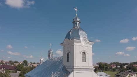 aerial view of a church with a silver roof